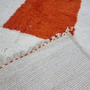White And Orange Rug