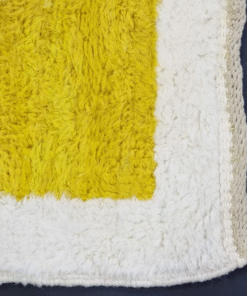 yellow and white rug