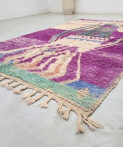 pink and off white rug on floor